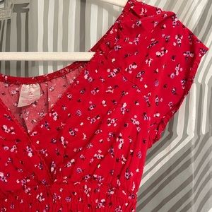 red flowery dress, body con in the middle